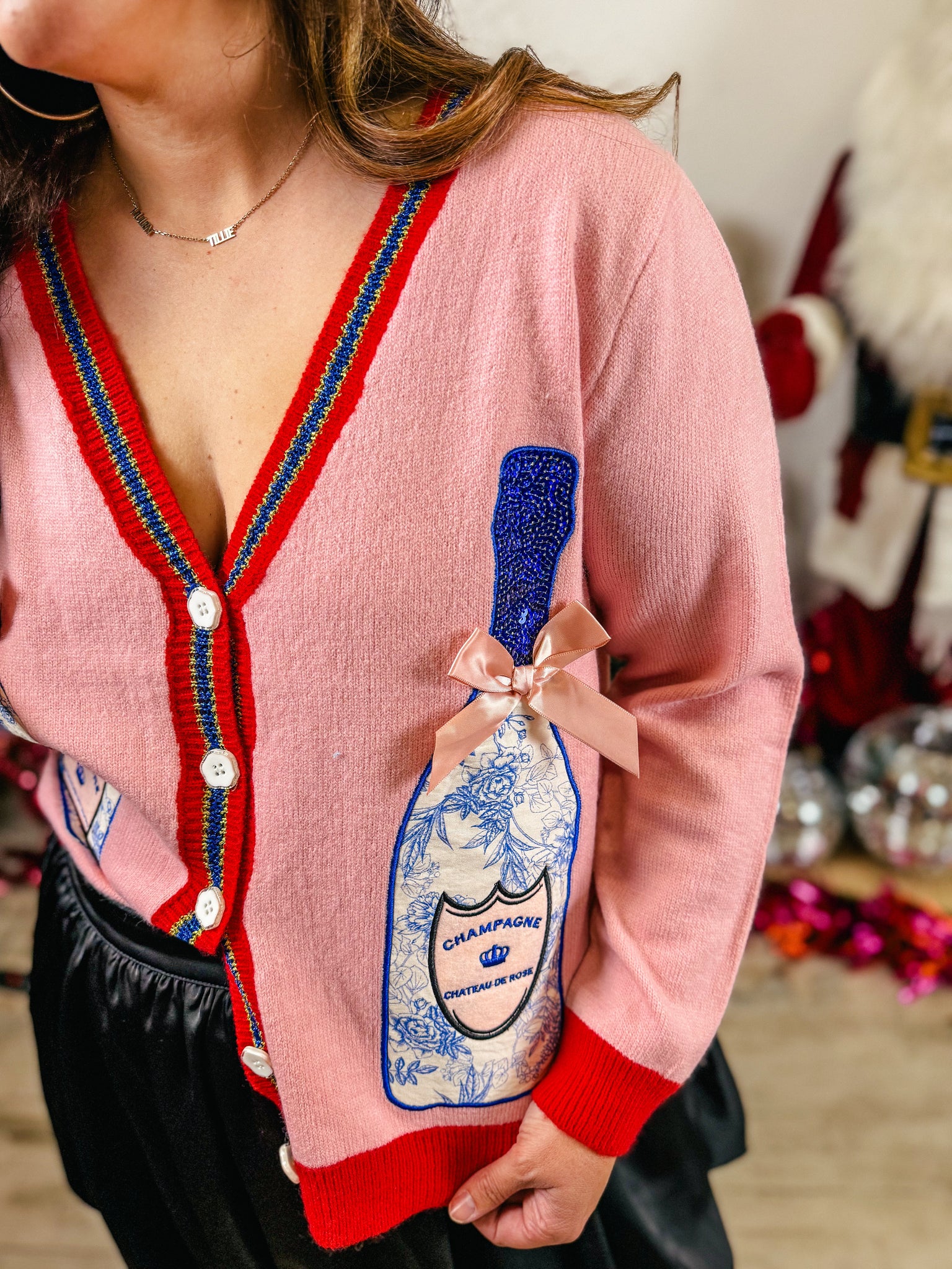 Pink Cardigan with Champagne Bottles
