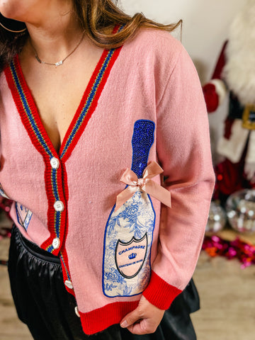 Pink Cardigan with Champagne Bottles